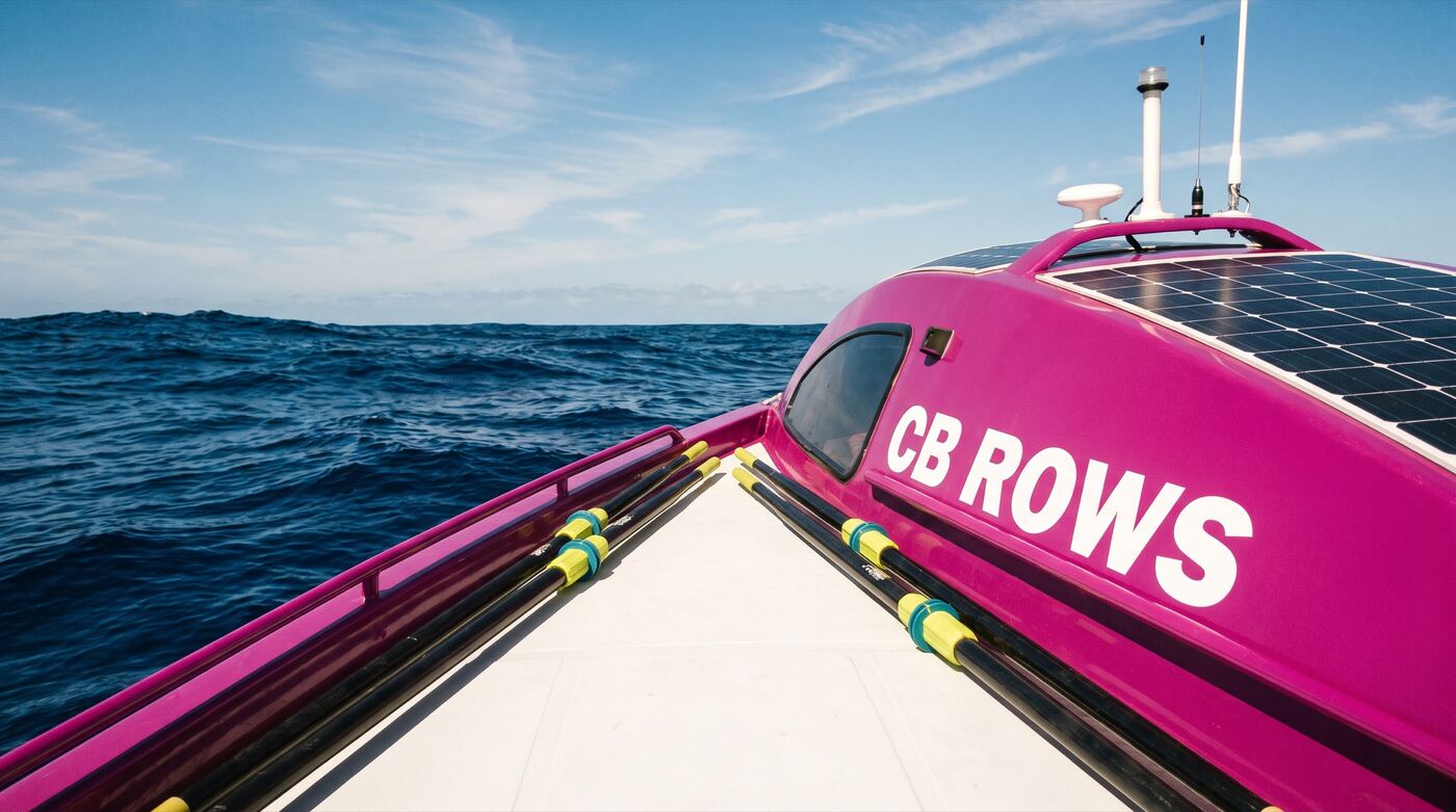 The deck of a pink ocean rowing boat on the Pacific